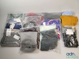 a lot of clothes that are sitting on a table