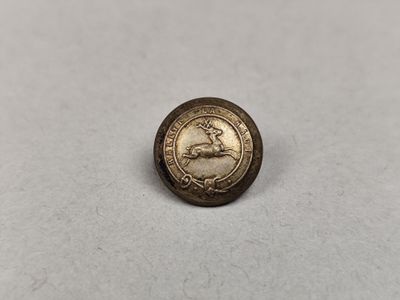 une pièce d'or sur laquelle est représenté un cheval