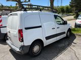 a white van that is parked in a parking lot