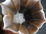 a close up of a metal object in a person ' s hand