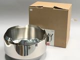a stainless steel bowl and a cardboard box on the table