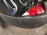 a close up of a car ' s tail light on the side of the car