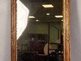 a mirror with an eagle on it and a mirror with a bird on it