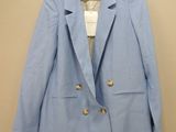 the jacket is blue and has gold buttons on the front