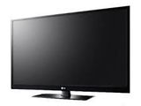 a black flat screen tv sitting on top of a white table