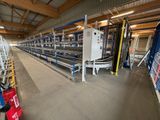 a long line of conveyor belts in a warehouse