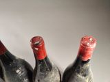 three bottles of wine sitting next to each other on a table