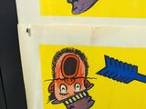 two stickers with cartoon characters on them on the wall