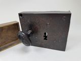an old lock on the side of a wooden box