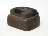 a small metal box with a black cover on top of it
