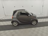 an image of a smart car parked in a garage