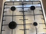 stove top with four burners and four burners on top of it