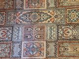 a large rug with many different colors and patterns on it