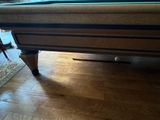 a pool table in the middle of a living room
