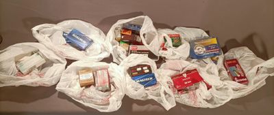 many bags of food that are sitting on a table