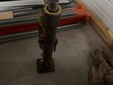 a fire hydrant in the middle of a pile of wood