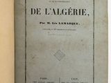 an open book with a black and white image of the title of a book