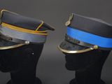 two hats with a blue band on top of them on a mannequin head