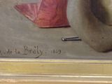 a picture of a painting of a hat on a table