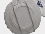a white plate with a blue and white design on it