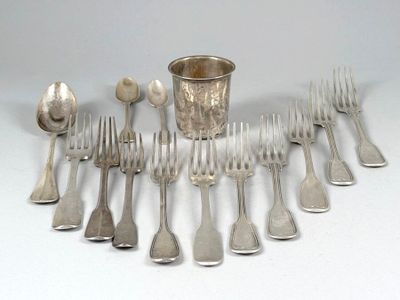 a lot of forks and spoons that are on the table