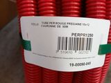 a close up of a person holding a red hose with a barcode on it