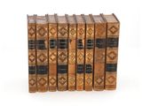 a set of five antique books sitting on top of each other