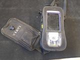 a cell phone and a bag sitting on the floor