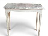 an old white table with a marble top on a white background