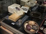 a glass display case with a variety of food items on it