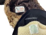 a black hat with a fur lined brimle on it
