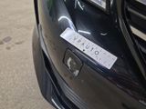a sticker on the front of a car that says touat