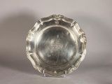 a silver plate that is sitting on a table