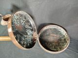 two pots that are sitting next to each other on a table