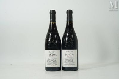 two bottles of wine sitting next to each other on a table