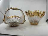 pair of gold and clear glass vases on a white surface