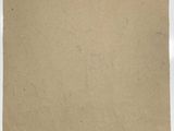 a piece of brown paper sitting on top of a white surface