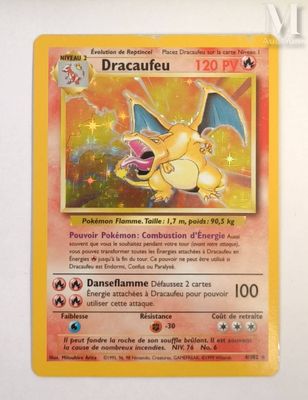the pokemon card has a yellow background and a yellow dragon on it