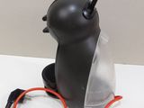 a small black object with a red cord attached to it