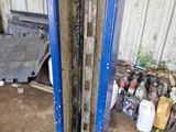an image of a garage with a blue door and a lot of tools