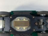a close up of a skateboard on a white surface