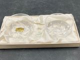 pair of clear glass glasses in a wooden box on a table