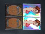 two cards with a picture of a woman in a bikini on them