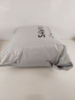 a pillow that is sitting on a bed in a room