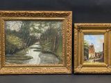 deux tableaux encadrés représentant une scène champêtre avec une rivière au premier plan et un village à l'arrière-plan