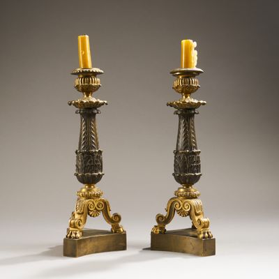 pair of antique brass candlesticks on stands