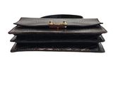 a close up of a black purse on a white background