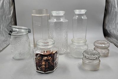 many jars and jars that are sitting on a table