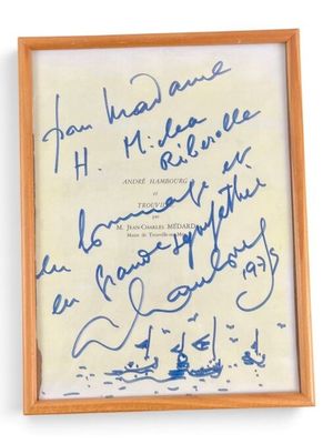 framed photograph of a signed autograph of a man and woman