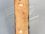 a piece of wood that has been cut and is sitting on a table